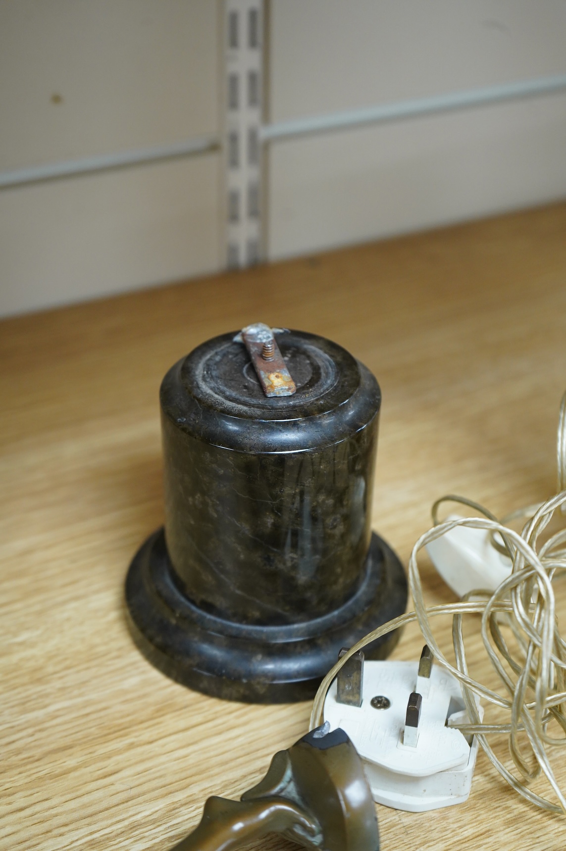 An Art Deco patinated spelter figural lamp, serpentine marble plinth (detached)